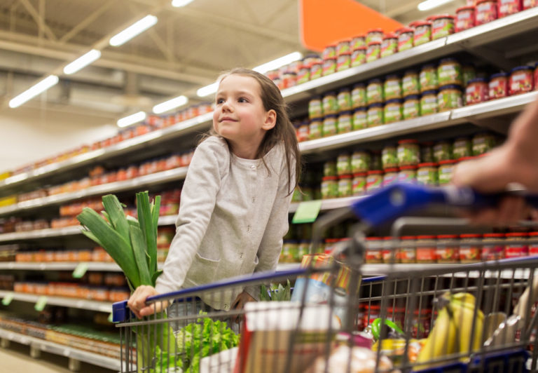 Young girl helping with grocery shopping