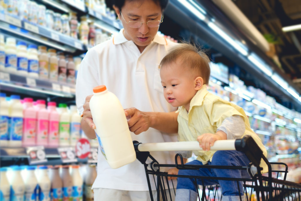Parent and child shopping for dairy
