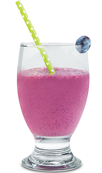 Blueberry blast smoothie in a glass with a straw