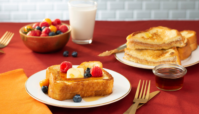 Hong Kong French Toast with butter, berries and glass of milk
