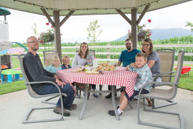 Dairy farming family having lunch together 