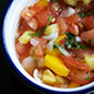 bowl of fresh tomato and mango salsa