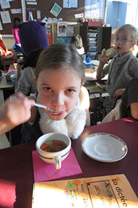 girl eating soup