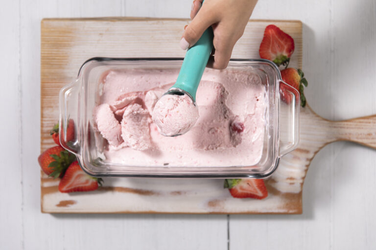 scoop of strawberry cottage cheese ice cream in a glass container