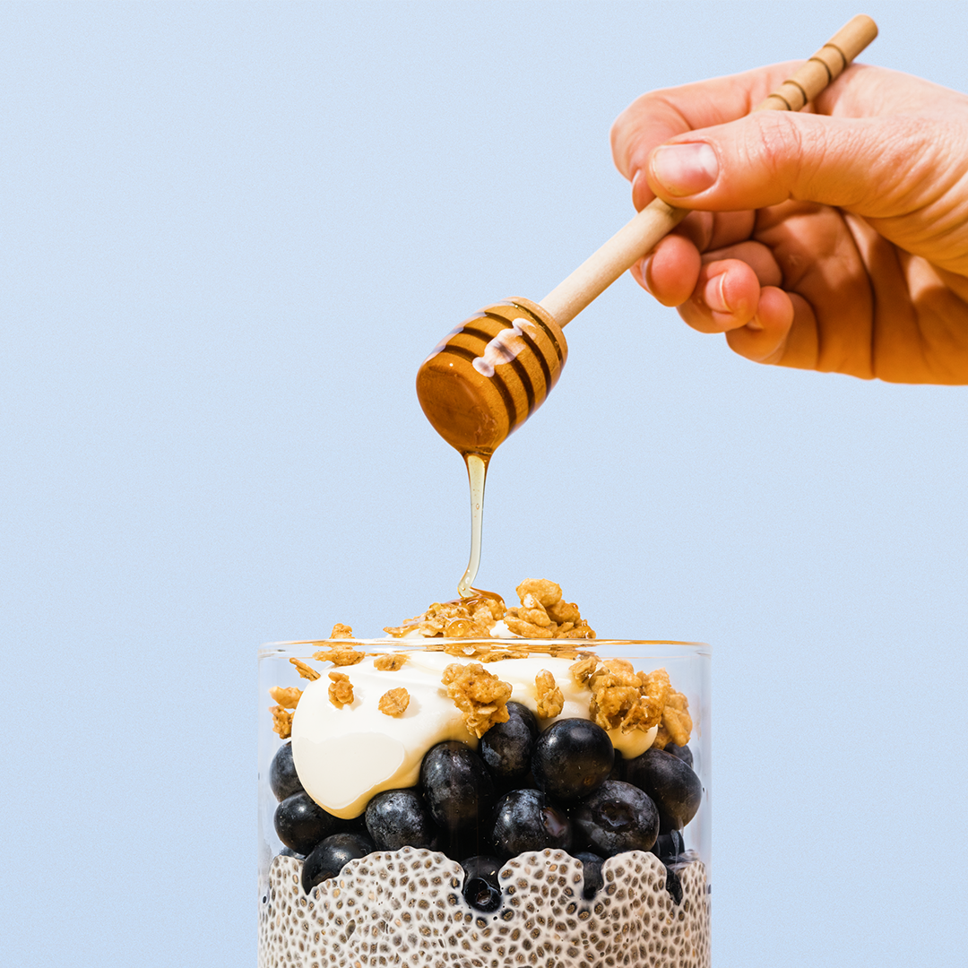 chia seed pudding with blueberries, yogurt and drizzle of honey