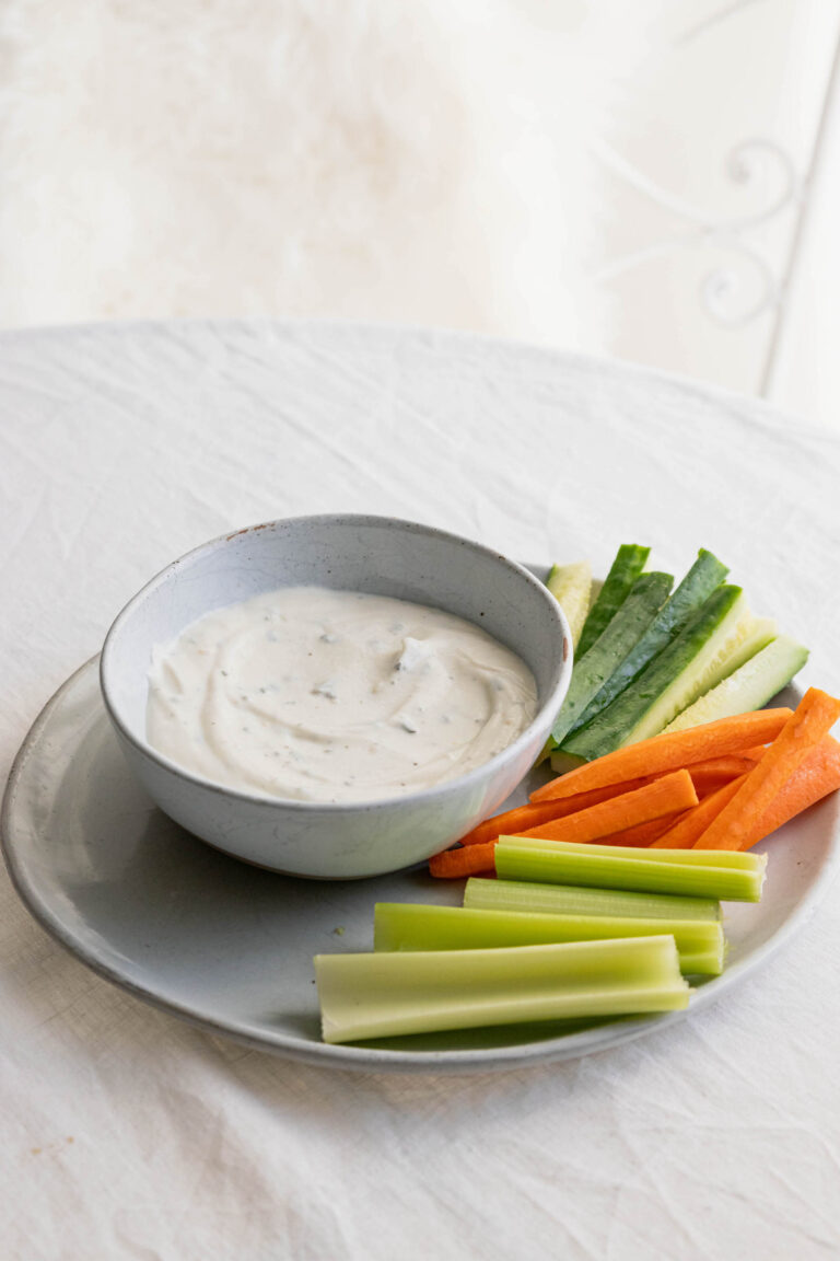 bowl of whipped ricotta dip with side of veggies