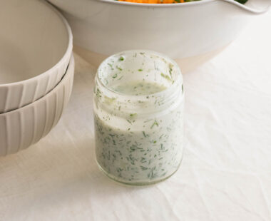 jar of ranch dressing a bowl of vegetables