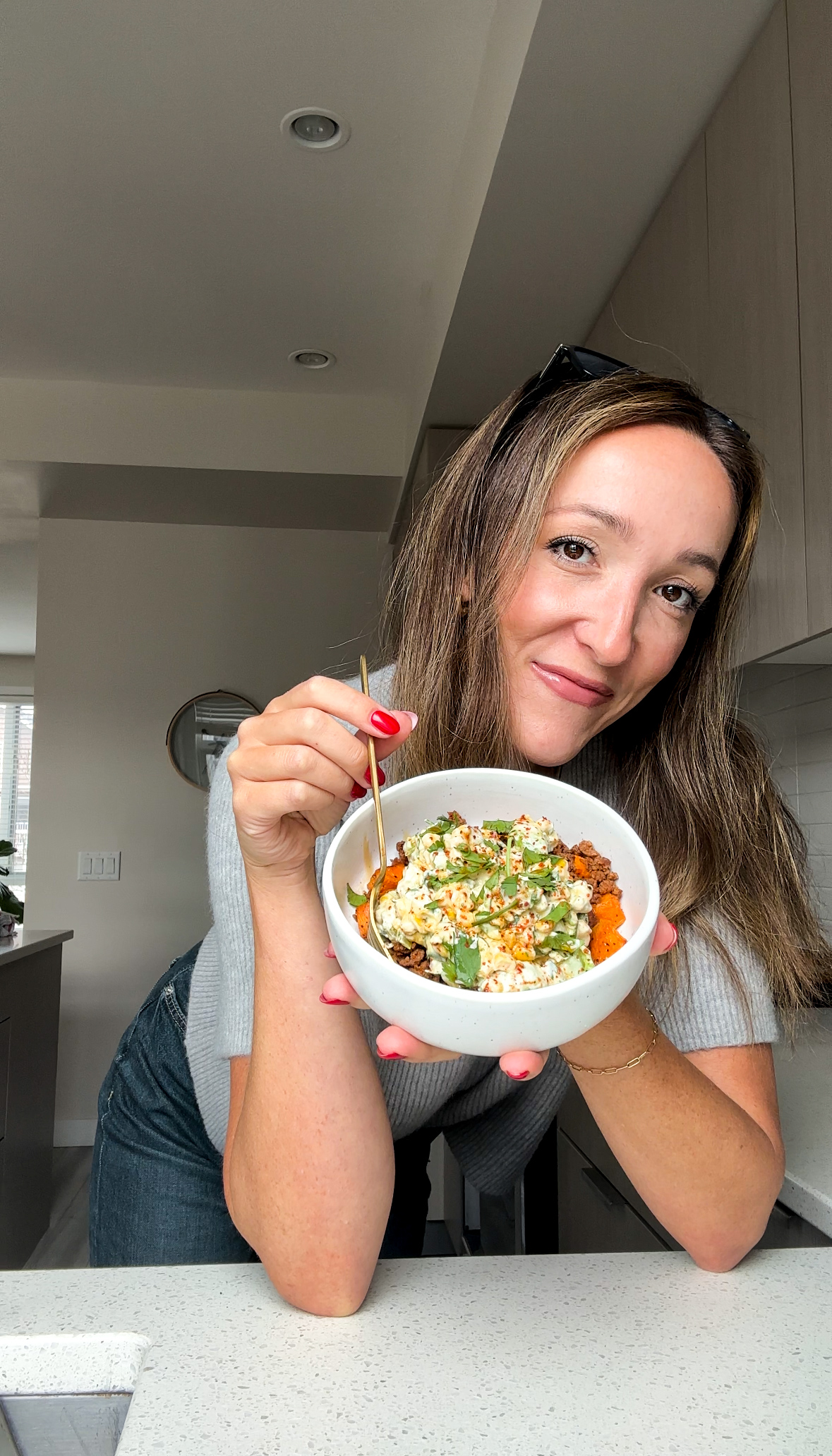 Holding sweet potato street corn bowl
