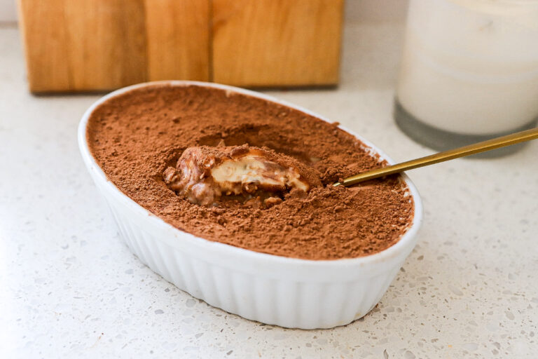 Bowl of Tiramisu overnight oats with a spoon digging in
