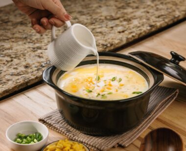 Creamy sweet corn and egg soup drizzled with cream