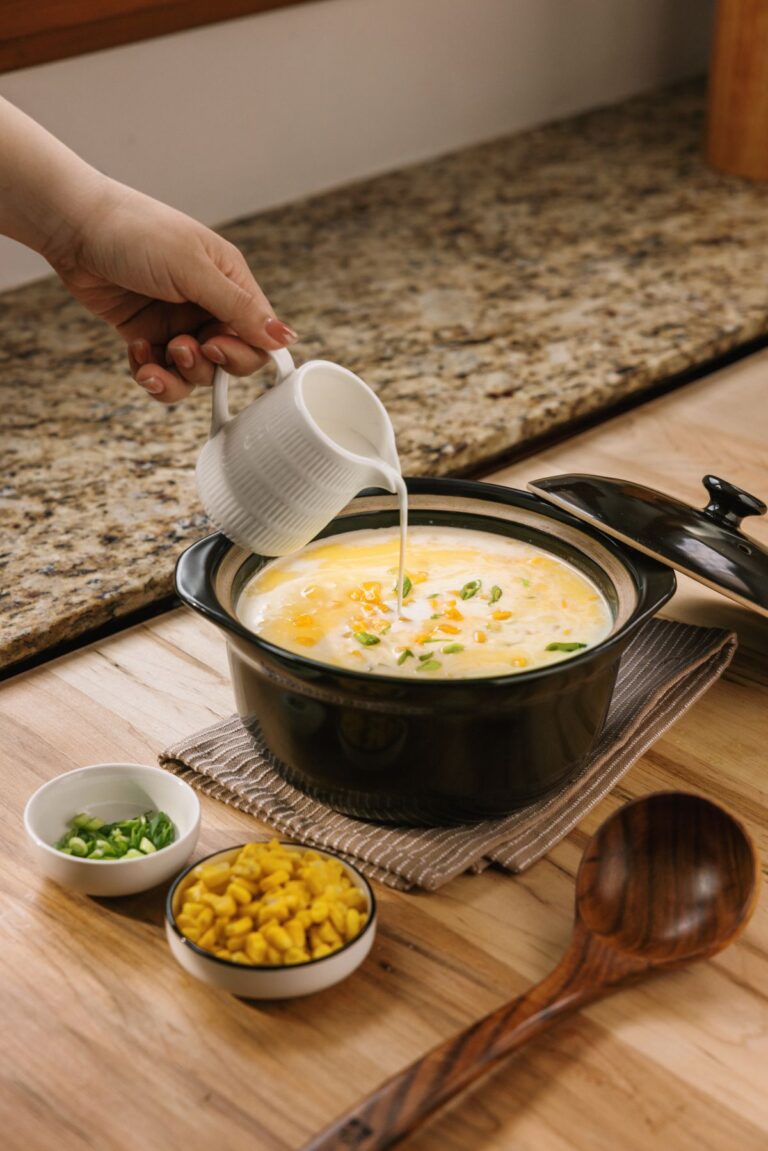 Creamy sweet corn and egg soup drizzled with cream