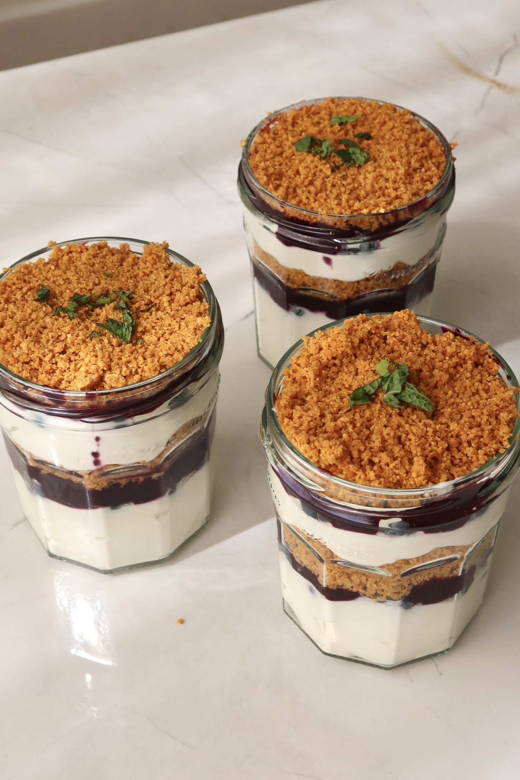 Blueberry parfait in glass jars